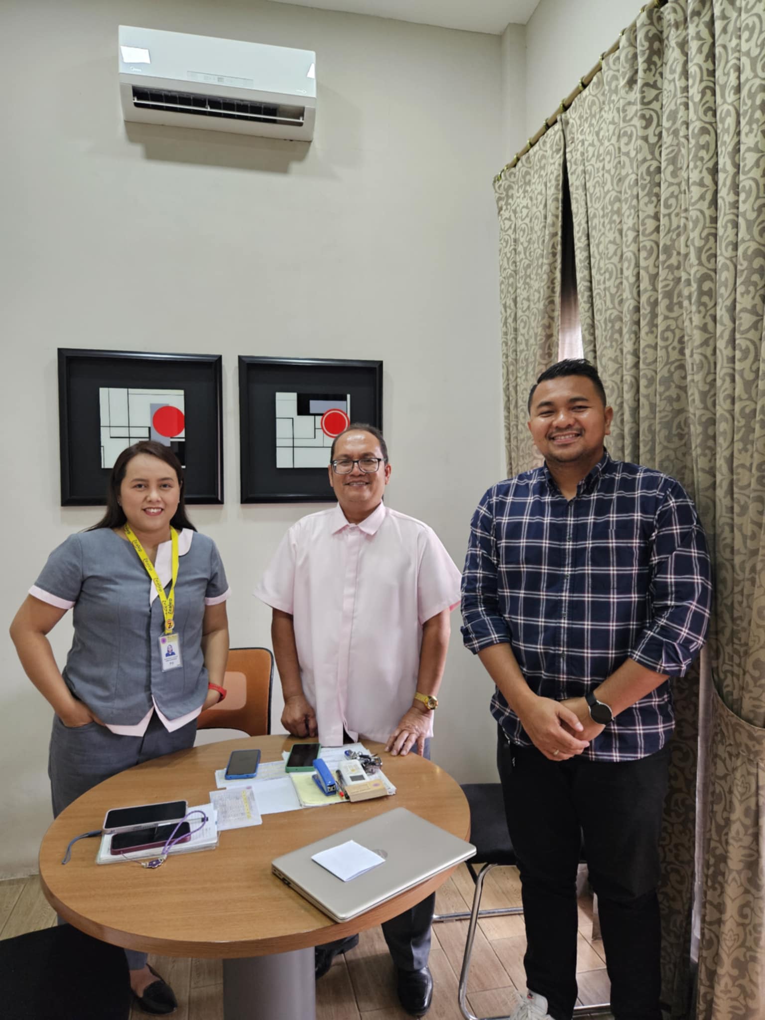 A photo with Mr. Ritchi Naong, Head of Divine Shepherd Memorial Services and Ms. Chris Cagape, Administrative Head